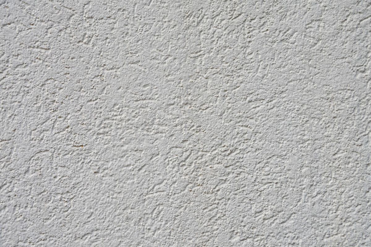 Daylight falling across a plain wall and the corner of a treatment chair